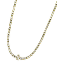 Collana tennis dorata con zircone centrale